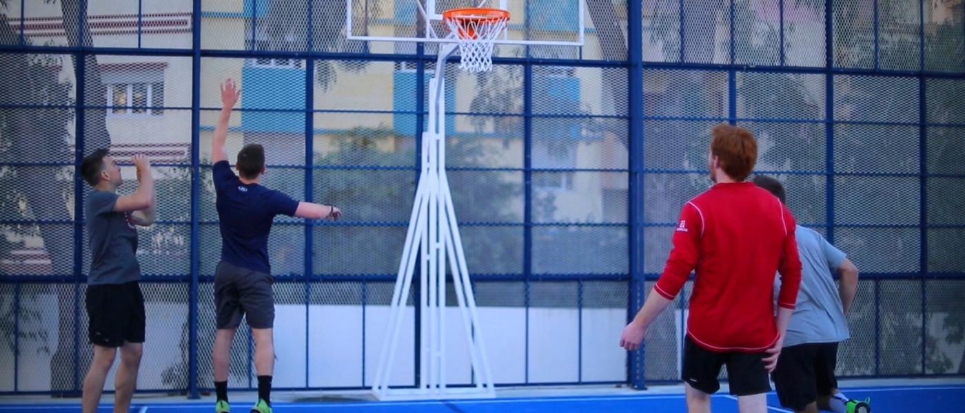 学生 play basketball on the basketball and volleyball court at U N E Tangier